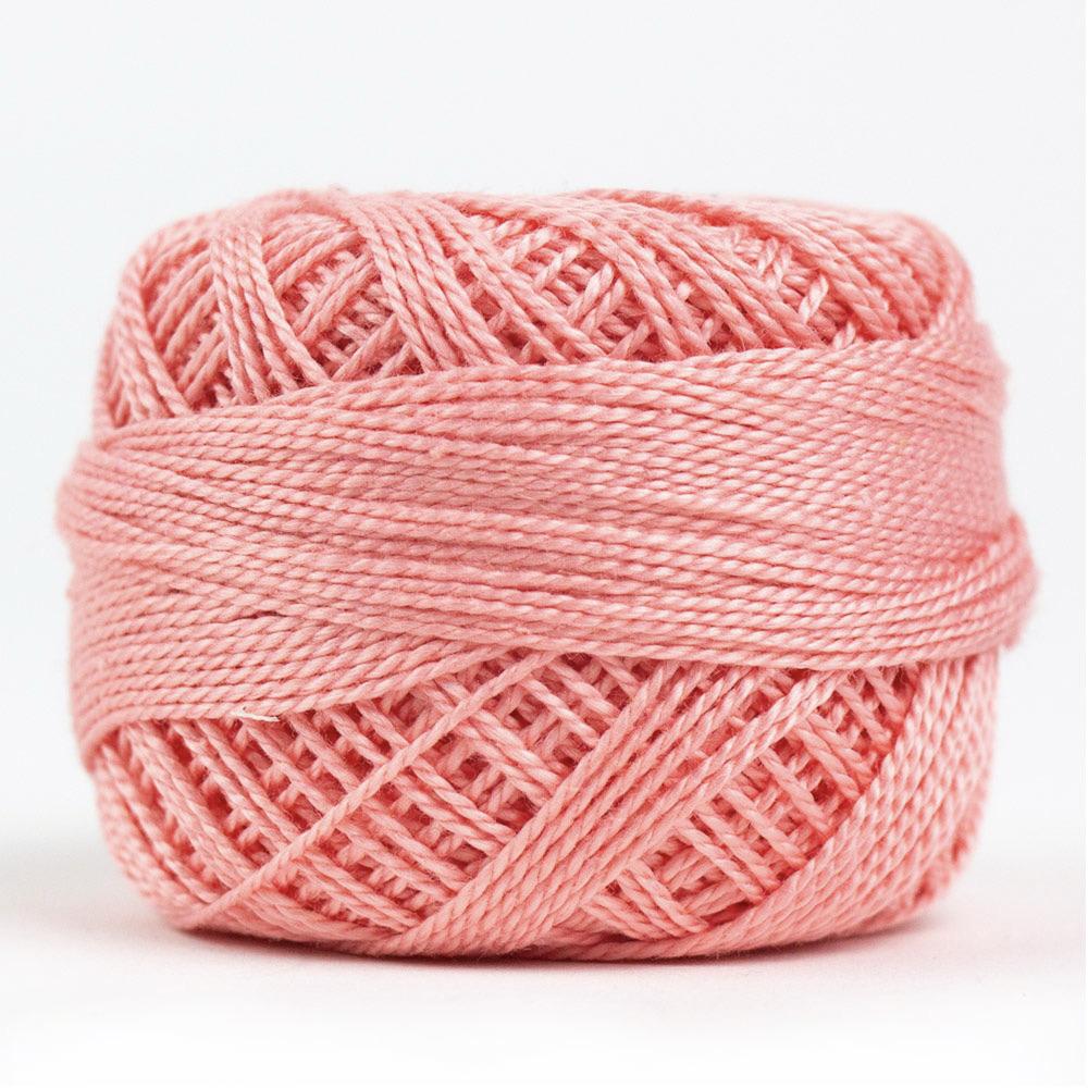 Side view of Perle cotton ball on white background to show color