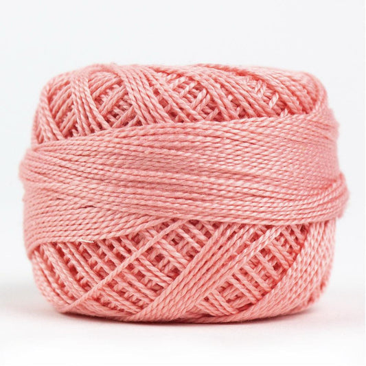 Side view of Perle cotton ball on white background to show color