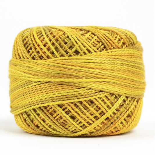 Side view of Perle cotton ball on white background to show color