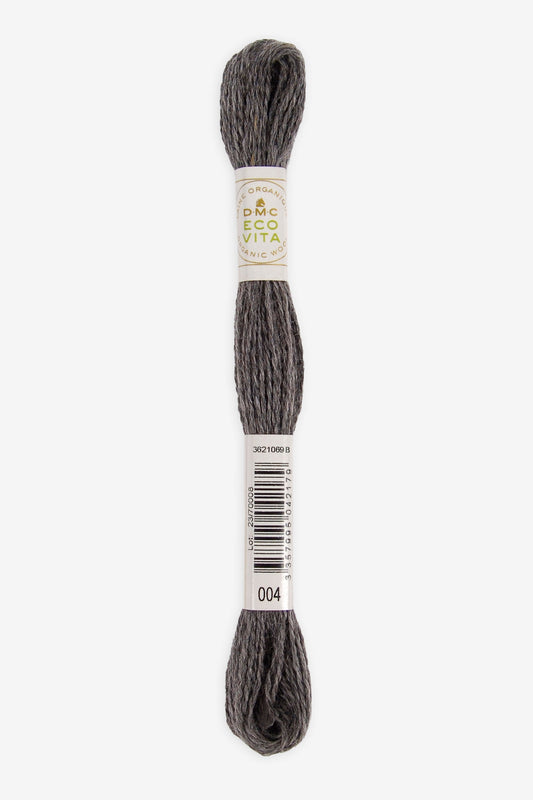 Single skein of Eco Vita Crewel Wool thread from DMC in color #004 against a white background