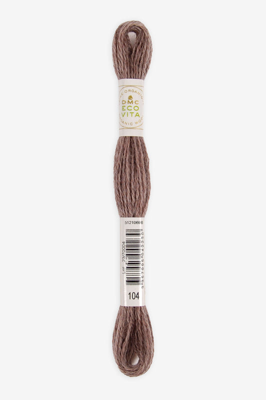 Single skein of Eco Vita Crewel Wool thread from DMC in color #104 against a white background