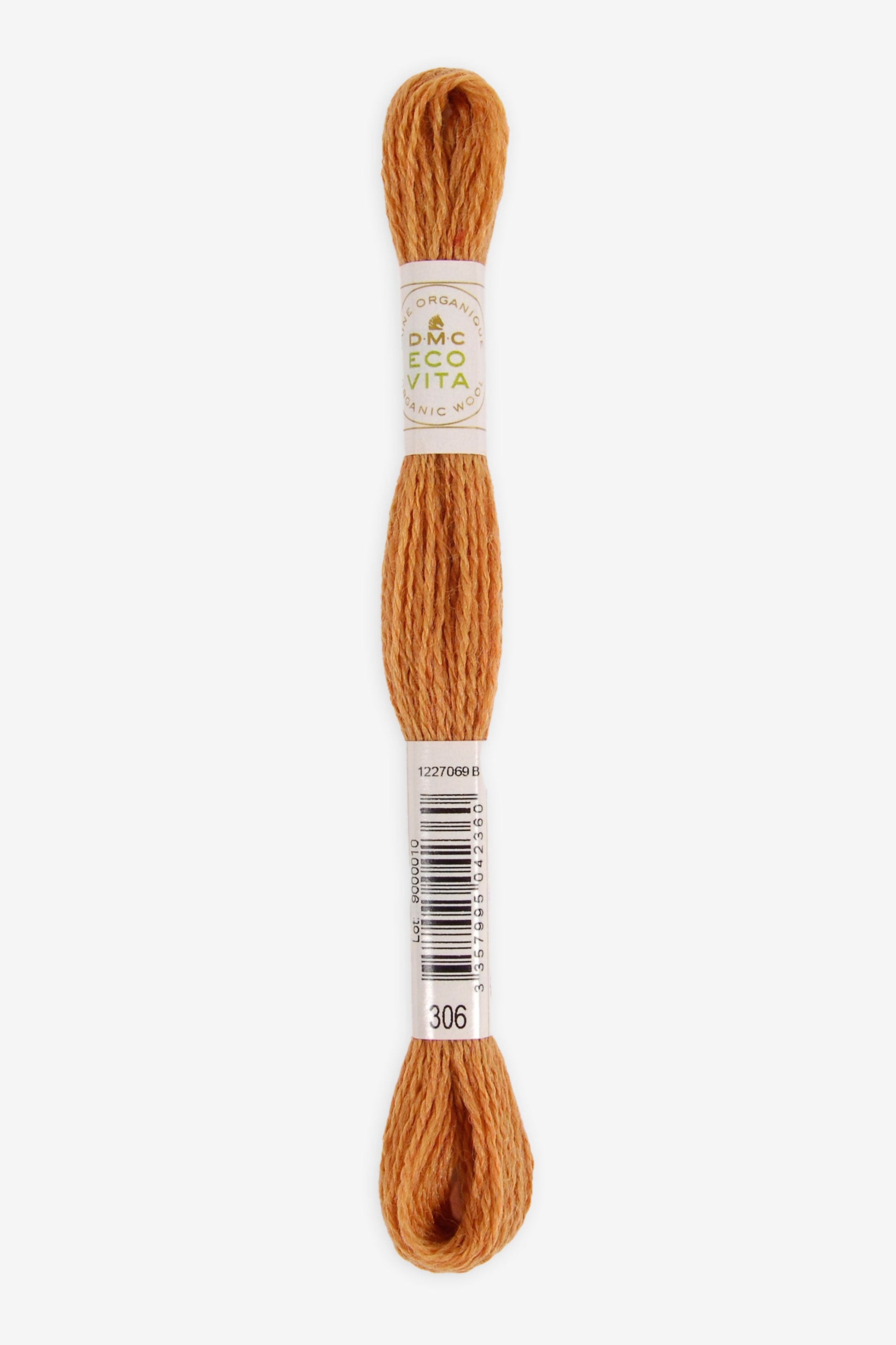 Single skein of Eco Vita Crewel Wool thread from DMC in color #306 against a white background