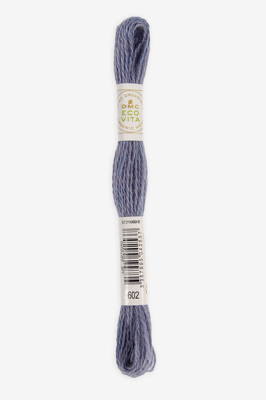 Single skein of Eco Vita Crewel Wool thread from DMC in color #602 against a white background