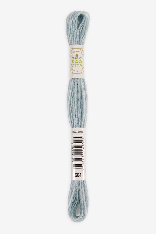 Single skein of Eco Vita Crewel Wool thread from DMC in color #604 against a white background