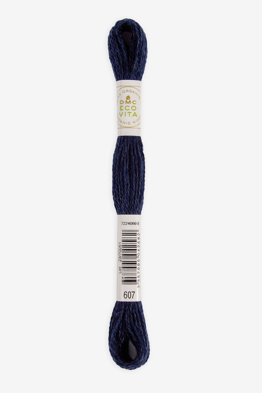 Single skein of Eco Vita Crewel Wool thread from DMC in color #607 against a white background