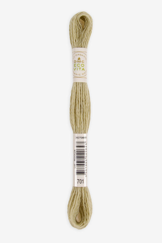 Single skein of Eco Vita Crewel Wool thread from DMC in color #701 against a white background