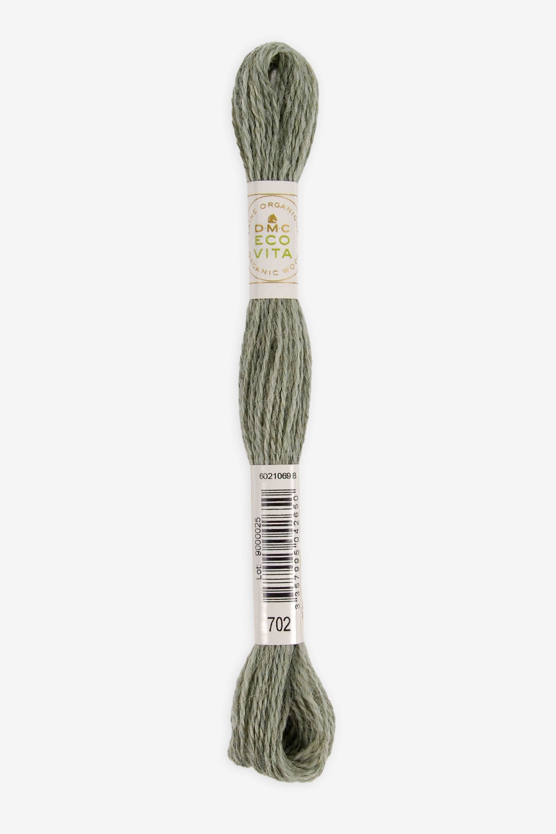 Single skein of Eco Vita Crewel Wool thread from DMC in color #702 against a white background
