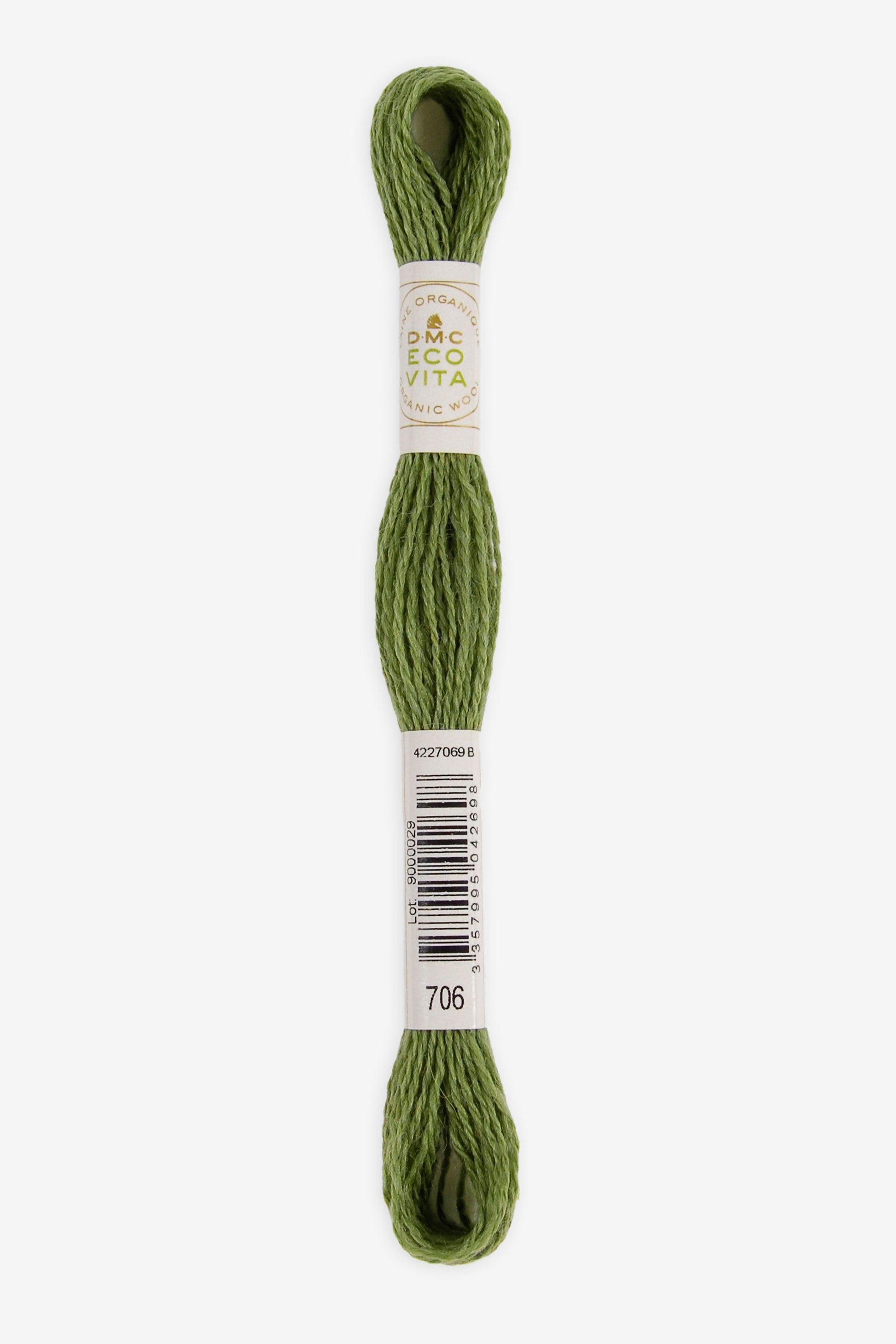 Single skein of Eco Vita Crewel Wool thread from DMC in color #706 against a white background