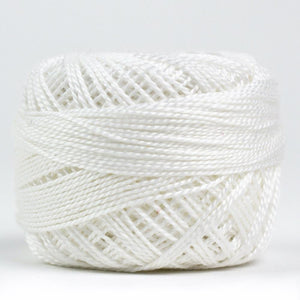 Side view of Perle cotton ball on white background to show color