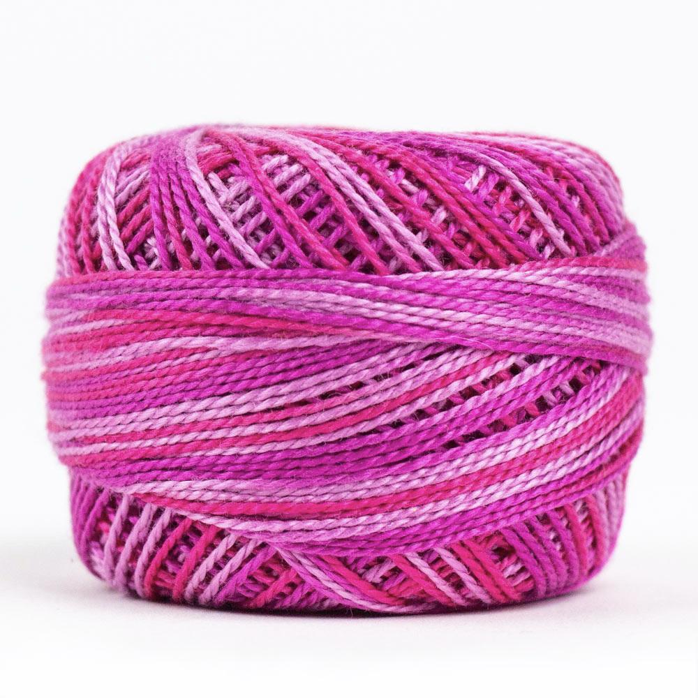 Side view of Perle cotton ball on white background to show color