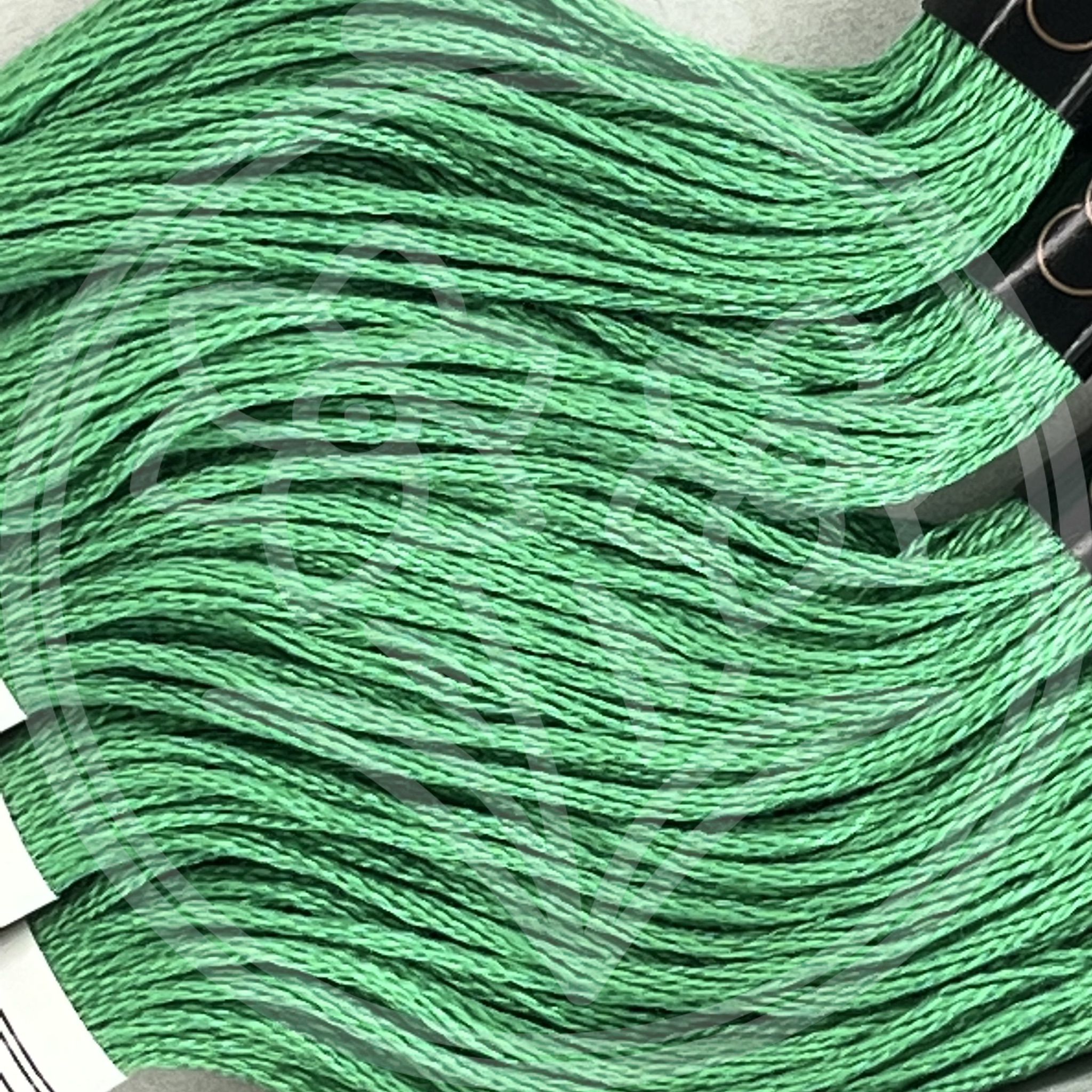 Closeup of multiple skeins, with a logo watermark