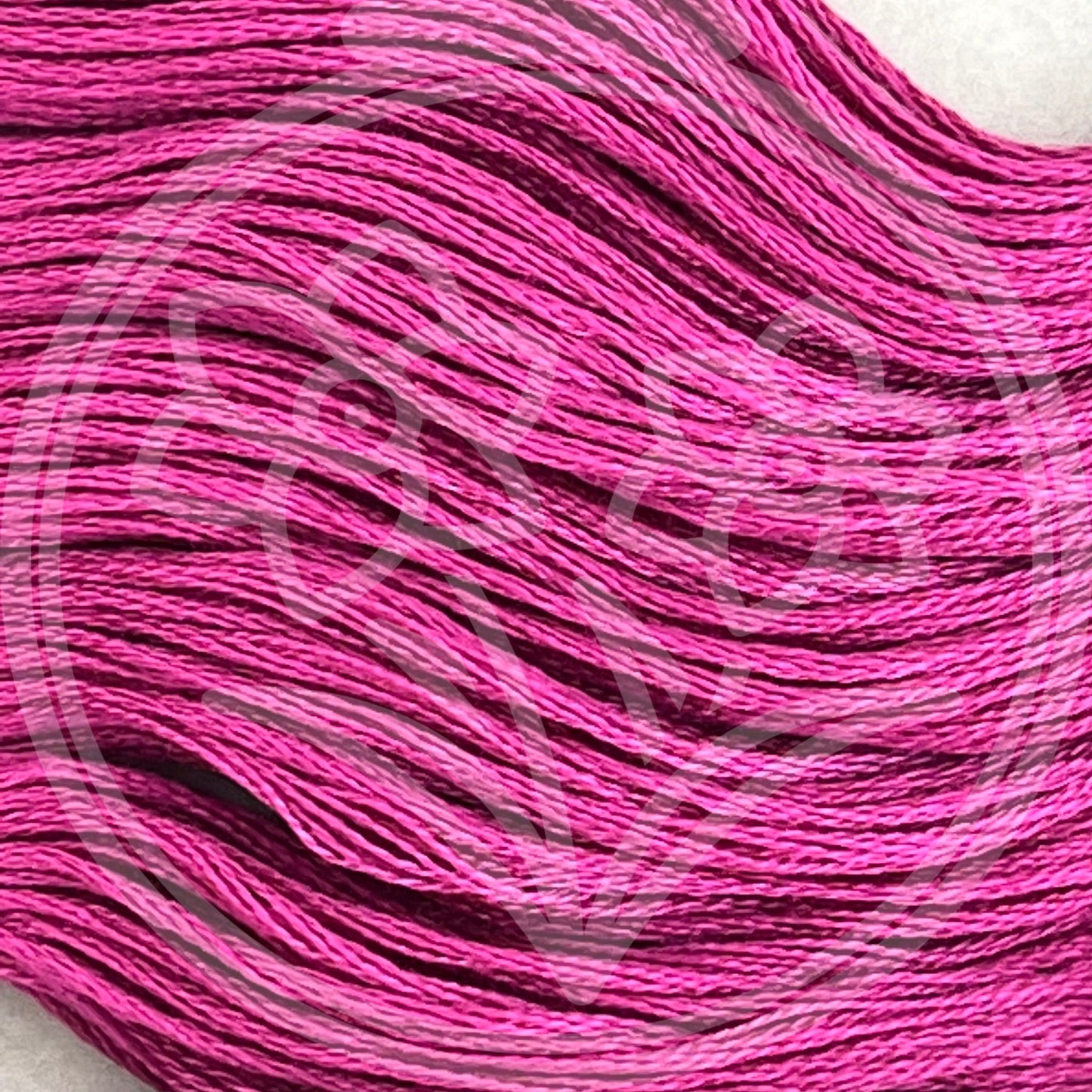 Closeup of multiple skeins, with a logo watermark
