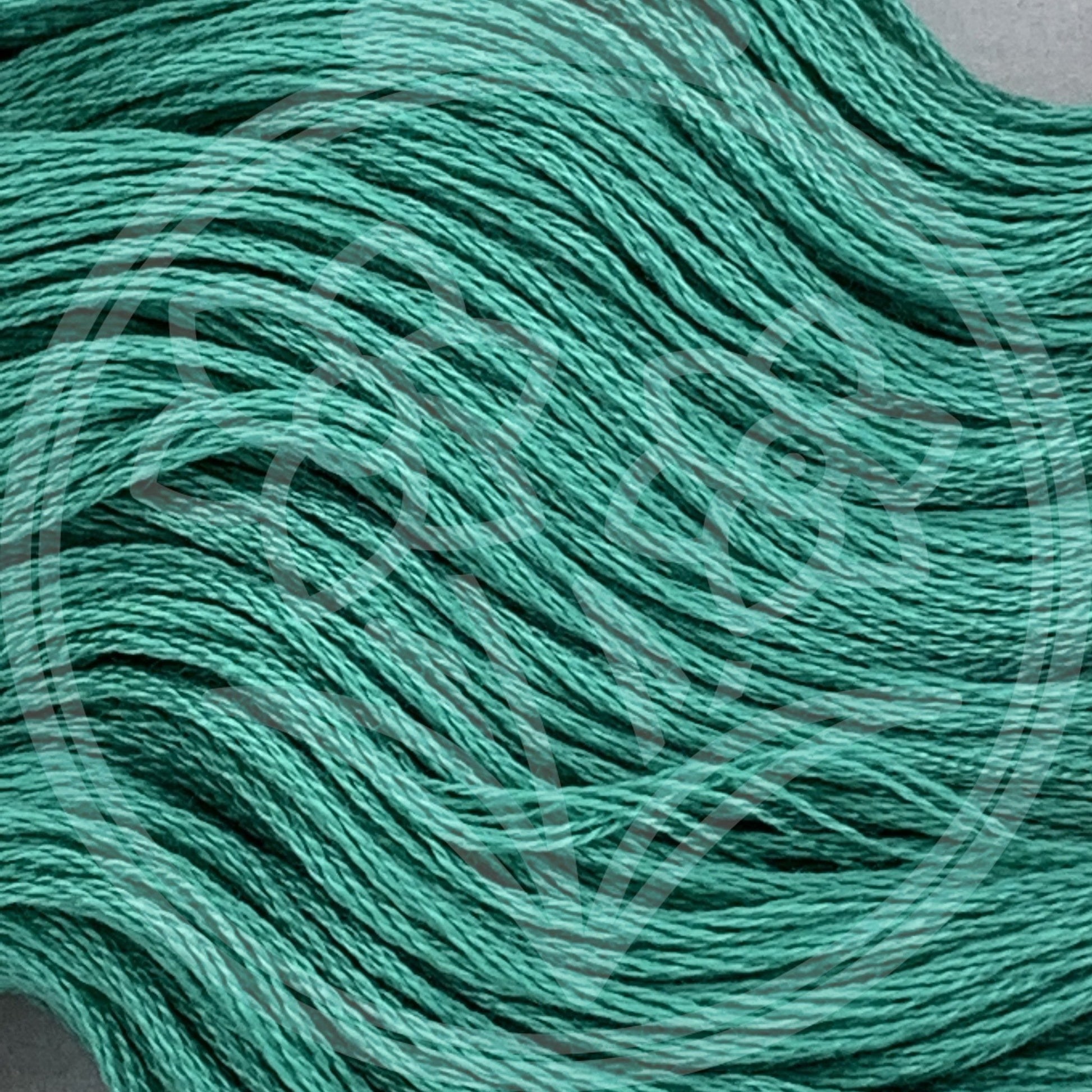 Closeup of multiple skeins, with a logo watermark